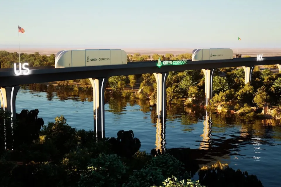 Rendering of autonomous cargo train moving across bridge across river in wooded area between Texas and Mexico.